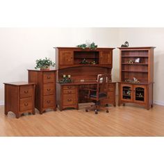 a wooden desk with two chairs next to it and an open bookcase on the other side