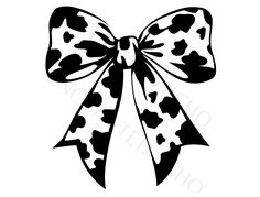 a black and white image of a bow with hearts on the front, in an old fashion style