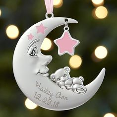 a personalized christmas ornament with a teddy bear sleeping on the moon