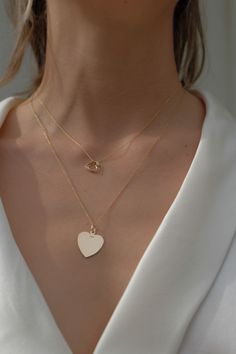 Each heart is handmade with love in our studio in California and measures approximatively 1cm x1cm=0.39". Add 1, 2 or 3 hearts max. Available in solid yellow gold 14k Length chain 16" or 18" Please note that each heart is handmade in our studio . The shape can vary a little 14k Gold Heart Pendant Charm Necklace, 14k Gold Heart Charm Necklace, 14k Rose Gold Necklace With Heart Charm, 14k Gold Necklace With Heart Charm And Cut, 14k Gold Heart Pendant Necklace With Adjustable Chain, Everyday Yellow Gold Heart Necklace In Sterling Silver, 14k Gold Tarnish-resistant Heart Necklace For Valentine's Day, Dainty 14k Gold Heart Cut Necklace, Delicate 14k Yellow Gold Heart Necklace