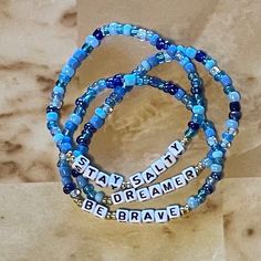 Choose a word to inspire you or a friend! Buy 5 site wide and get 20% off your order. Use code:SAVE20 Bracelet Name, Inspirational Bracelets, Personalized Bracelet, Bracelet Blue, Glass Bracelet, Personalized Bracelets, Name Bracelet, A Word, Arm Band