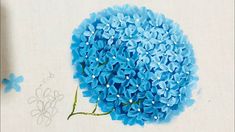 a blue flower on a white background