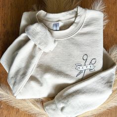 "This gift is for a custom hairstylist shirt!  This is the ultimate hairdresser personalized gift.  Would be the best appreciation or \"treat yourself gift\" for any barber, salon coworker or hair dresser.   Prefer a hoodie?  Check out that listing here -----> https://hivebeautycollective.etsy.com/listing/1595713460 Looking for a male hairdresser gift, click here --------->  https://hivebeautycollective.etsy.com/listing/1611453483 Want it in a t-shirt? --------> https://hivebeautycollective.etsy.com/listing/1602351116 Want a gift without worrying about sizing? Try it tote style here -------> https://hivebeautycollective.etsy.com/listing/1522474579 How to Order: ❤️ simply choose the correct size and colour that you would like to purchase.   ❤️ refer to the listing photos for the colour and Interior Design Beauty Salon, Salon Ideas Hairdressing, Hair Salon Suite Decor, Hair Salon Marketing Ideas, Hair Stylist Marketing, Hair Salon Suite, Salon Decorating Ideas, Decor Beauty Salon, Salon Decorating