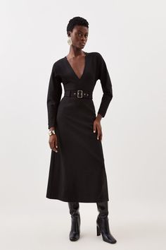 Experience Elevation In Your Every Day Wardrobe With Our Midi Dress, Featuring A Flared Silhouette That Flatters The Curves, With A Belted Waistline To Cinch The Silhouette, And A Plunging V Neckline. Style It With Block Heels Or Loafers For A Casual Approach, Then Strappy Stilettos For An Occasion Look. Ponte Belted Midi Dress High Quality Ponte Fabric Flattering Fit And Flare Silhouette Cinched, Belted Waistline Deep V Neckline Zip Back Fastening Fall Cocktail Belted Dress, Fitted Knee-length Belted V-neck Dress, Belted V-neck Maxi Dress For Work, Black V-neck Maxi Dress For Work, Fitted V-neck Belted Midi Dress, Fitted Belted V-neck Midi Dress, V-neck Belted Midi Dress For Date Night, Fitted Belted Maxi Dress For Night Out, Fall V-neck Belted Dress