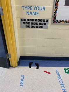 a classroom door that has some writing on the floor