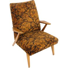 an upholstered chair with wooden legs and floral fabric on the armrests