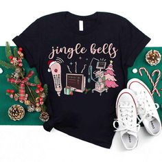 a t - shirt that says,'single bells'next to some christmas decorations