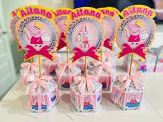 peppa pig themed birthday party favors on a table