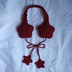 a crocheted headband with two ear pieces attached to it