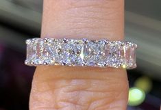 a woman's hand with a diamond ring on it