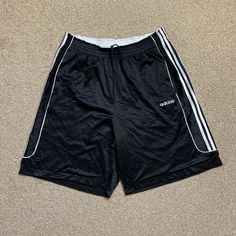 "Adidas Vintage Shorts Basketball Shorts Long Sports Exercise Festival Retro XL. Condition is \"Used\". Dispatched with Royal Mail 2nd Class Letter.  Has some signs of wear (see photos) but still has plenty of life left in it!  Size: XL  Measurements: Waist measures approx 36.5 inches when relaxed (waist is elasticated so it will expand & fit bigger than the latter measurement) Length (top to bottom): 23.5 inches Leg opening (flat across/width): 15.5 inches  Message for quote on International Delivery.  Check out our other items and feel free to message us for more information :)  S3" Affordable Men's Adidas Shorts, Three Stripes Athletic Shorts For Gym, Gym Athletic Shorts With Three Stripes, Sporty Striped Shorts For Gym, Vintage Basketball Shorts, Mens Shorts Outfits, Sports Exercise, Adidas Vintage, Adidas Shorts