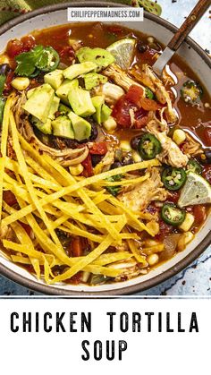 chicken tortilla soup in a bowl with shredded cheese and avocado