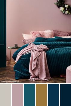 a bedroom with pink, teal and blue colors