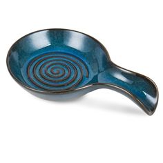 a blue bowl with spiral designs on it