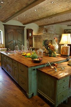 a large kitchen with an island in the middle and two turkeys on it's head