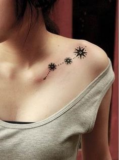 a woman's chest with small stars on it