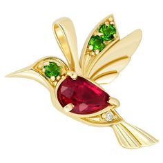 14k Gold Hummingbird Pendant with Rubies. Bird Pendant with colored gemstones. 14 kt gold bird pendant with ruby, tsavorites and diamond. Weight: 0.9 g. Size: 12x16.6mm Set with ruby, color - red pear cut, 0.7 ct. in total (6x4 mm size) Clarity: Transparent with inclusions 3 tsavorites, 2.2 mm each (0,15 ct), pink color, round cut, transparent 1 diamond - 0.01 ct, G\VS, round brilliant cut Gold Hummingbird, Red Pear, Ruby Color, Hummingbird Pendant, Colored Gemstones, Bird Pendant, Modern Necklaces, Modern Pendant, Jewellery Collection