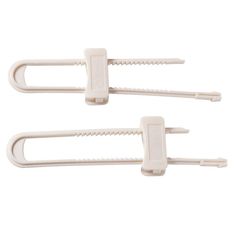 two white plastic clips on a white background