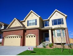 a home for sale with a sold sign in front