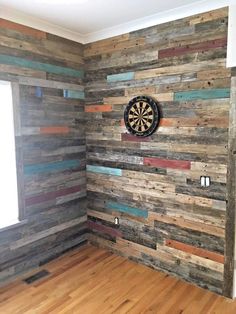 a room with wood paneling and a dart on the wall