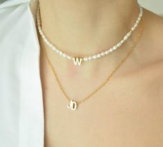 GET UP TO 30% OFF ON SELECTED ITEMS, VISIT OUR SHOP TO SEE MORE AND HAVE FUN! This delicate Pearl Initial Necklace is the most trendy, affordable and high-quality handmade piece you ever have. This personalized letter necklace is a great birthday gift, bridesmaid or mom gift option because it is so personal and dainty that everyone how got it will feel special #namenecklace#customletternecklace#initialnecklace#personalizedjewelry#birthdaygift#mothersday#handmadenecklace#pearlbeadednecklace Personalized Dainty Pearl Necklace, Gift Pearl Necklace With Letter Beads, Letter Beads Pearl Necklace Gift, Personalized Dainty Pearl Necklace As Gift, Personalized Pearl Necklaces As Gifts, Personalized Pearl Necklace As A Gift, Personalized Pearl Necklace As Gift, Personalized Pearl Necklace For Gift, Pearl Necklace With Letter Beads As Gift