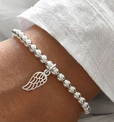 925 Sterling Silver Stretch Angel Wing Bracelet 4mm Sterling Silver round beads  10mm Sterling Silver Angel Wing Charm Stack of 2 includes: one Angel Wing Bracelet  one 5mm Plain Bracelet Elegant Silver Charm Bracelet With 8mm Beads, Silver Sterling Silver Beaded Bracelets With 8mm Beads, Silver Pearl Bracelet With 8mm Beads As Gift, Silver Pearl Bracelet With 8mm Beads For Gift, Silver Sterling Silver Bracelet With 8mm Beads, Silver Charm Bracelet With 8mm Beads, Silver Bracelet With 8mm Beads As Gift, Elegant Silver Rosary Bracelet With 8mm Beads, Plain Bracelet