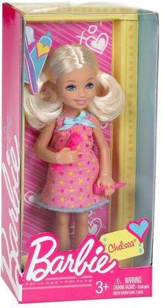 a barbie doll with blonde hair and blue eyes in a pink dress standing inside a box