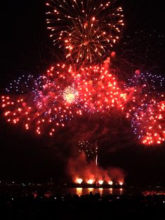 fireworks are lit up in the night sky