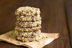 a stack of cookies sitting on top of a piece of paper next to a wooden table