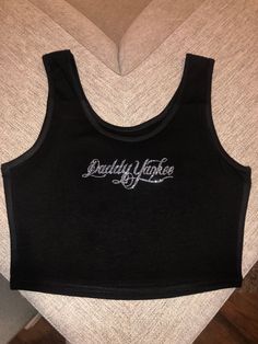 Super cute vintage style daddy Yankee crop top, perfect for his upcoming tour ! Or for a cute gift. This is for the ladies that want something Y2K style perfect top for the tour ! ** primary color is for the letters color** These shirts are pressed professionally so the glitter does not fall off !✨ ** DISCLAIMER shirts have a snug fit so please size up ! Y2k Streetwear Tank Top With Letter Print, Trendy Letter Print Tank Top For Streetwear, Y2k Style Letter Print Tank Top For Streetwear, Y2k Cotton Tank Top For Streetwear, 90s Letter Print Tank Top For Streetwear, Y2k Cotton Crop Top For Streetwear, Band Merch Crew Neck Crop Top For Streetwear, Crew Neck Crop Top Band Merch For Streetwear, Streetwear Band Merch Crop Top With Crew Neck