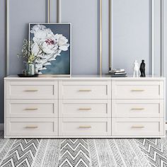 a white and gold dresser in a blue room