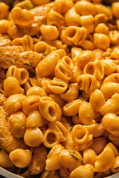 macaroni and cheese is being cooked in a pan