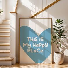 this is my happy place poster on the wall next to a potted plant and stairs