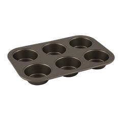 an empty muffin pan with six cupcakes in it on a white background