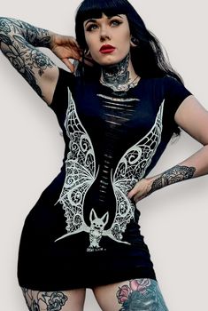 VAMPIRE Lace Wings SS Mini Dress Vampire Lace wings original hand drawn graphic tee printed on a comfy womens fitted tshirt dress made of 95% cotton and 5% spandex for an easy fit with Sizing: Fit Guide: Model 33" bust wearing Small Small: 33-34" bust 26-27" waist Medium: 35-36" bust 28-31" waist Large: 37-39" bust 32-33" waist XL: 40-41" bust 34-35" waist 2X: 42-44" bust 36-37" waist sku: Sku: VP10 Demi Loon Alternative Gothic Clothing CAT LADY DRESS,WITCH DRESS,BLACK MAGIC DRESS,PENTAGRAM DRES Fitted Tshirt Dress, Pentagram Dress, Cowboy Outfits For Women, Witchcraft Clothing, Fitted Tshirt, Witchy Dress, Lace Wings, Magic Dress, Witch Dress