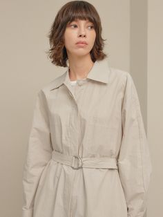 Editor's notesIt is a shirt dress inspired by trench coat design. The dress features a belt, hidden button, top-stitching point, pockets on the front, and side slits. It is a refreshing dress made of cotton fabric.- Relaxed fit- Trench coat design- Top-stitching point- Side slits- 100% CottonMeasurements(in.)One Size- Shoulder: 21.3 in.- Chest: 22.8 in.- Hem: 24.6 in.- Sleeve Length: 20.3 in.- Sleeve: 9.1 in.- Front Length: 39.4 in.- Back Length: 40.9 in.*Model info- Height 5’ 9” Bust 34” Waist Spring Belted Shirt Dress With Spread Collar, Spring Workwear Shirt Dress With Belted Cuffs, Spring Shirt Dress With Belted Cuffs, Spring Shirt Dress With Belted Cuffs And Spread Collar, Classic Belted Shirt Dress For Spring, Spring Beige Shirt Dress With Placket, Chic Neutral Shirt Dress For Work, Chic Beige Shirt Dress With Pockets, Beige Shirt Dress For Spring Office Wear