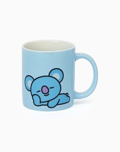 a blue mug with a cartoon bear on it