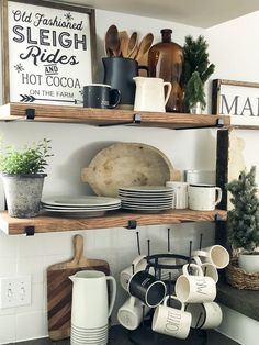 the shelves are filled with dishes and mugs