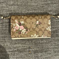 Brand New Bag Barely Used Beautiful To Look At With The Evergreen Floral Pattern, Beautiful Cream Shoulder Belt Coach Cream Clutch Bag, Coach Beige Clutch Bag, Coach Beige Wallet With Removable Pouch, Shoulder Belt, Bags Coach, Coach Bag, New Bag, Coach Bags, To Look