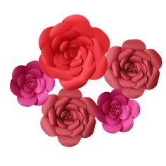 red and pink paper flowers arranged in the shape of three large, four smaller flower heads