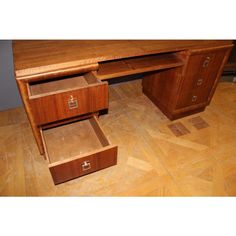 a wooden desk with two drawers on it