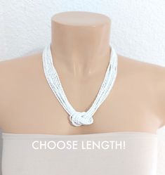 "White Necklace, bridesmaids gifts , white beaded necklace, boho necklace, knot necklace, retro necklace The necklace has 8 strands . The size shown in the picture is 18\". Please read specifications on SIZES below: ❤ SIZES This item comes in several sizes, kindly choose at checkout. The easiest way to find out which length suits you best is to measure a necklace you already own, from one end to the next, including clasp. You can also use the diagram on the pictures as a reference, but keep in mind that we all have different neck and body sizes. If you'd like a clasp extender, please add this to the cart: https://www.etsy.com/listing/187503833/clasp-extender.  ❤ PROCESSING AND SHIPPING Most orders are made and shipped out in one business day. Please check delivery timeframes for your locat White Bohemian Bridal Necklace For Gift, White Bohemian Bridal Necklace, Bohemian White Bridal Necklace, White Multi-strand Necklace For Gift, White Multi-strand Beaded Necklaces, White Multi-strand Beaded Necklace, Adjustable White Bridal Necklace As Gift, Adjustable White Bridal Necklace Gift, White Beaded Necklace