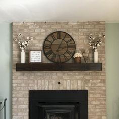 a fireplace with a clock on the mantle