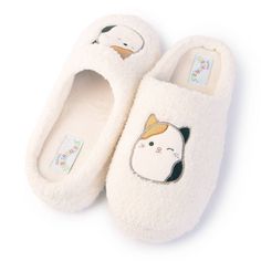 Step into comfort and fun with Squishmallows Women's Cam The Cat Plush Clog Slippers in Cream. These cozy slippers feature your favorite cam the cat characters, bringing a playful touch to your loungewear. Made from lightweight material makes them perfect for relaxing at home. Ideal for cam the cat fans of all ages, these slippers combine comfort, style, and a bit of childhood magic in every step. Cute Soft Synthetic Slippers, Kawaii Synthetic Slippers With Round Toe, Playful Indoor Synthetic Slippers, Cute Soft Slippers For Indoor Use, Cute Soft Indoor Slippers, Kawaii Slip-on Synthetic Slippers, Kawaii Synthetic Slip-on Slippers, Cute Closed Toe Synthetic Slippers, Cute Super Soft Indoor Slippers