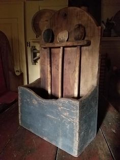 an old wooden chair sitting on top of a wooden floor