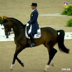 a man riding on the back of a brown horse