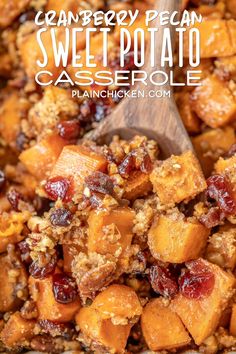 cranberry pecan sweet potato casserole in a pan with a wooden spoon