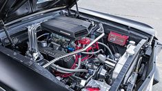 the engine compartment of a car with its hood open