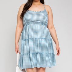 Picnic in the Park Gingham Strappy Dress in Blue PLUS This sleeveless (with crossed straps in the back!) dress is perfect for an impromptu afternoon picnic or a moonlit walk on the beach. 100% Rayon Blue Beach Dress With Crisscross Straps, Blue Beach Dresses With Crisscross Straps, Casual Sundress With Adjustable Straps For Picnic, Spring Picnic Sundress With Tie Straps, Gingham Sundress For Brunch, Gingham Dress With Tie Straps For Beach, Summer Gingham Dress With Adjustable Straps, Beach Dress With Gingham Print And Tie Straps, Summer Gingham Sundress For Vacation