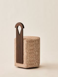 a chair made out of fabric with a wooden handle